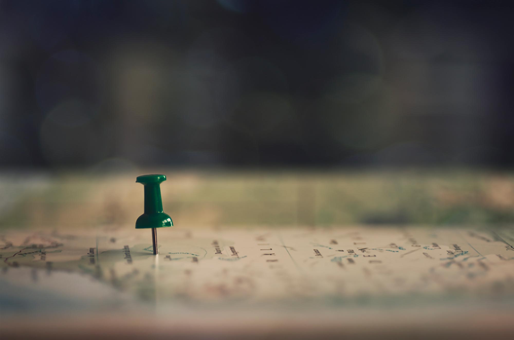Macro image of a green pin in a map